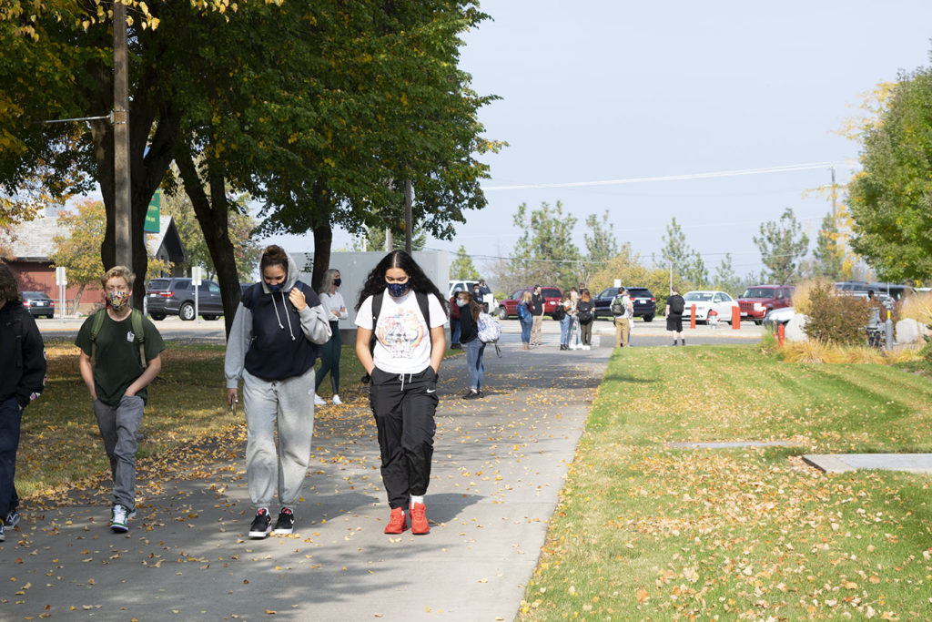 students walking wearing masks 