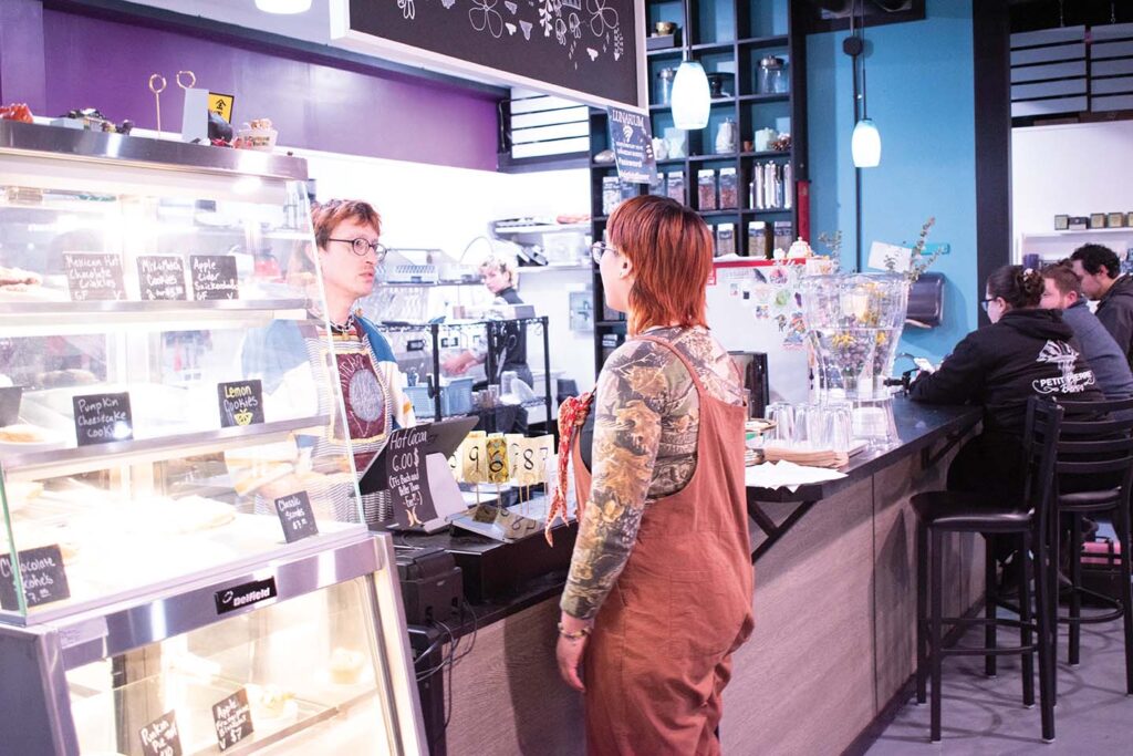 James Hamm (right) talking with a staff member 