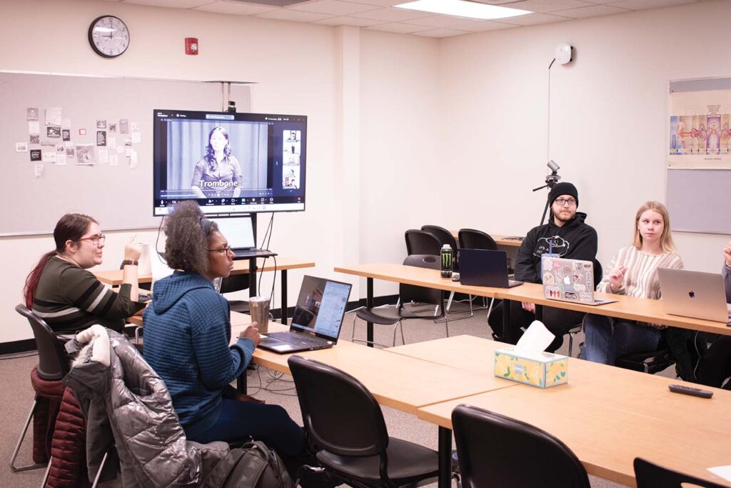 Left to Right: Robyn Blyker, Sha Rogers, Mars Rochen, Alyvia Huffman, and online students in Interpreting Training class. 