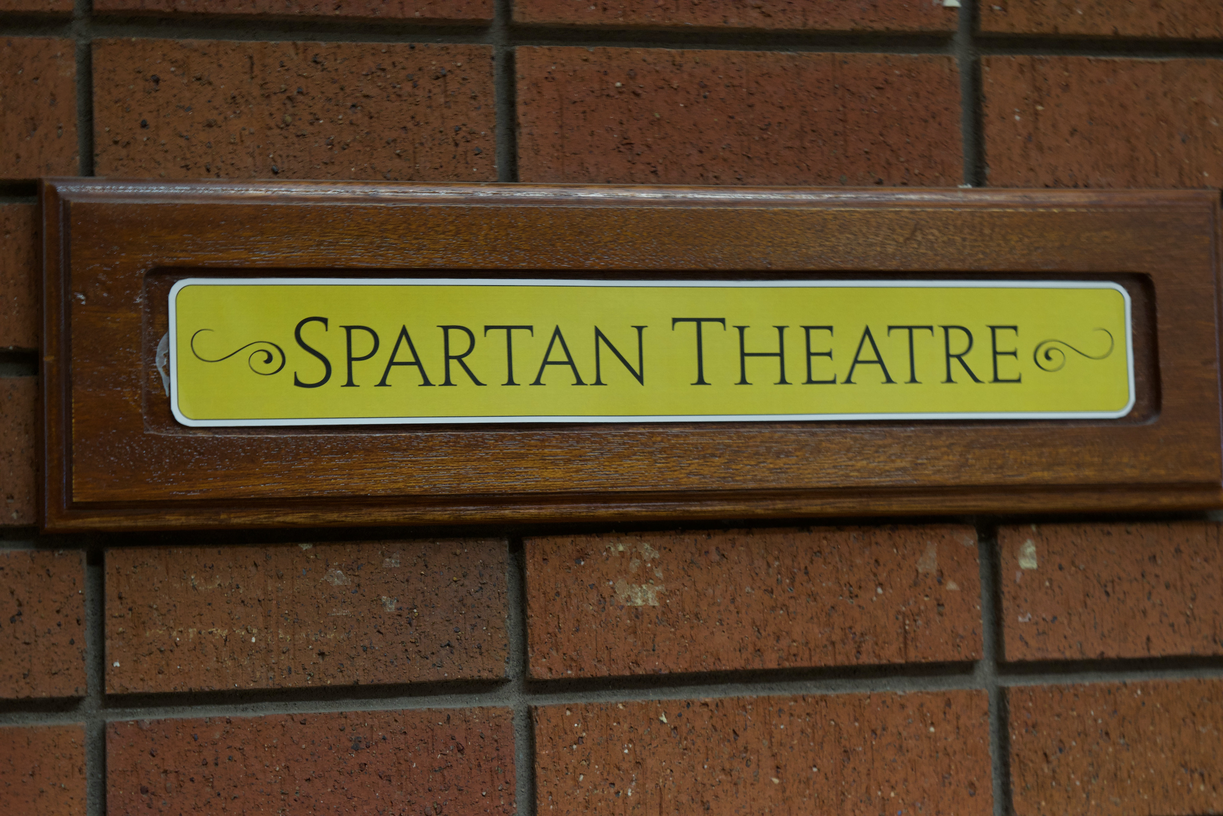 Photo of plaque that says "Spartan Theatre" on it.